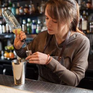 Barmaid pouring a drink